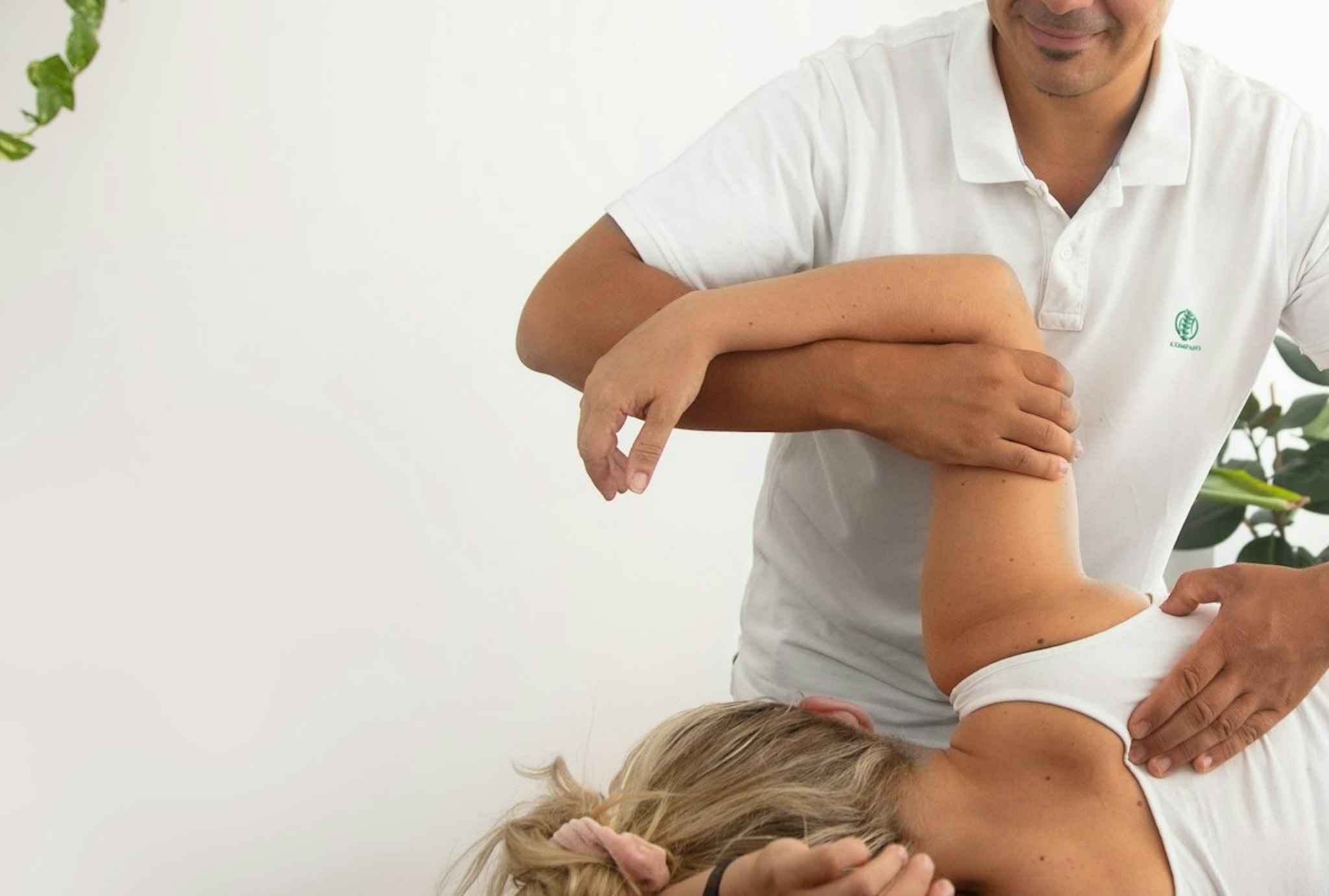 Chiropractor adjusting patient